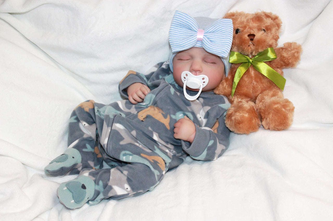 A baby adorned with a bow, gently holding a teddy bear, radiating innocence and joy.