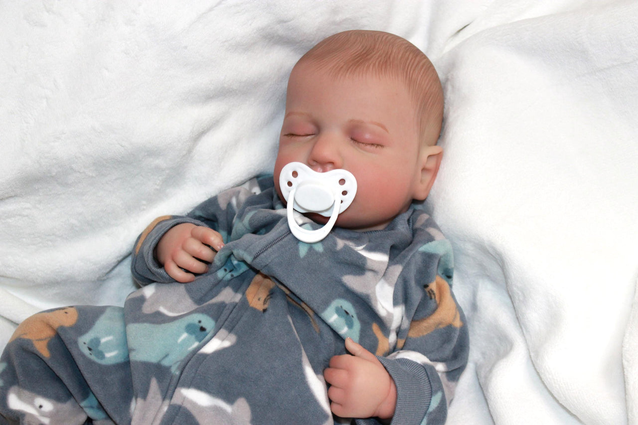 A peaceful baby sleeps soundly, a pacifier gently resting in its mouth, embodying tranquility and innocence.