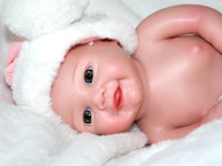 Thumbnail for A baby doll wearing a pink and white outfit, featuring a sweet expression and soft, cuddly features.
