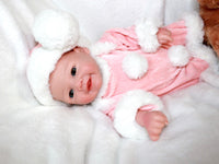 Thumbnail for A baby doll wearing a pink and white outfit, featuring a sweet expression and soft, cuddly features.