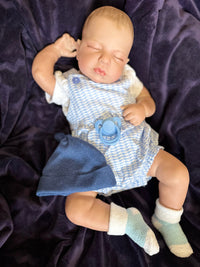 Thumbnail for Realistic 20-inch reborn baby doll with closed eyes, blue hat, romper, and socks – lifelike sleeping newborn doll for gifting and collecting