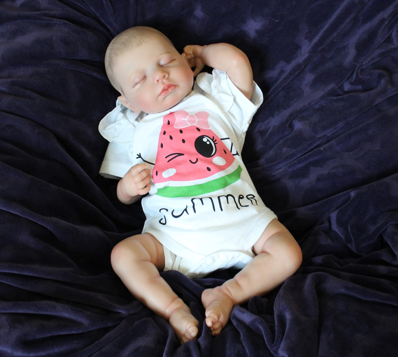 Reborn doll in watermelon outfit that says summer. Lifelike Reborn Baby Doll 20” 2 to 8 Pounds Weighted Newborn Baby Girl/Boy Soft Heavy Baby Dolls For Children Child Friendly Gifts For Girls