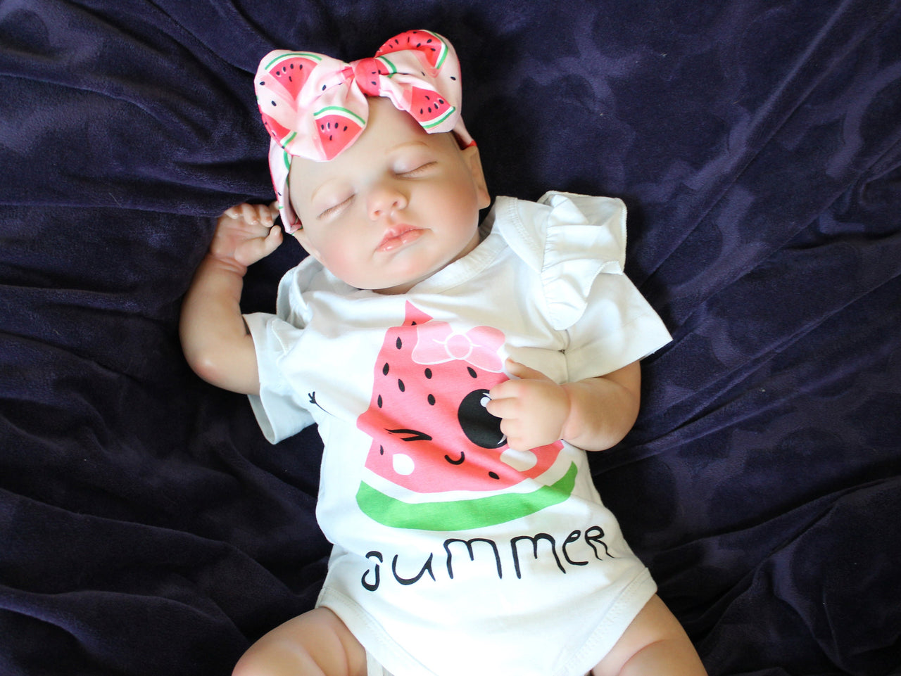 Reborn doll in watermelon outfit that says summer. Lifelike Reborn Baby Doll 20” 2 to 8 Pounds Weighted Newborn Baby Girl/Boy Soft Heavy Baby Dolls For Children Child Friendly Gifts For Girls