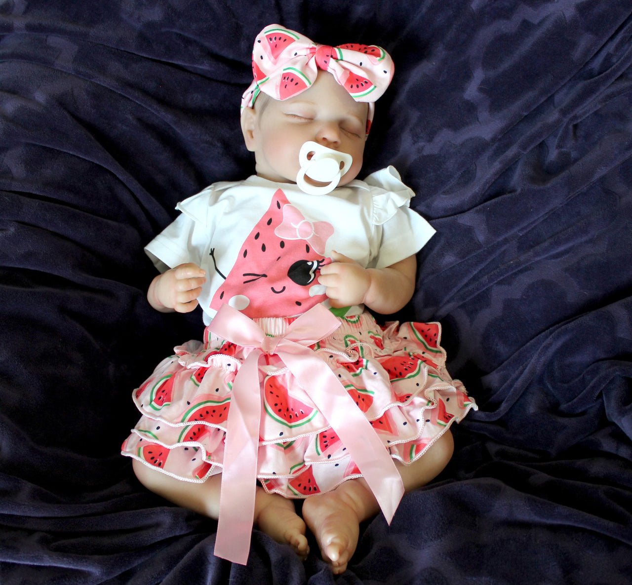 Reborn doll in watermelon outfit that says summer. Lifelike Reborn Baby Doll 20” 2 to 8 Pounds Weighted Newborn Baby Girl/Boy Soft Heavy Baby Dolls For Children Child Friendly Gifts For Girls