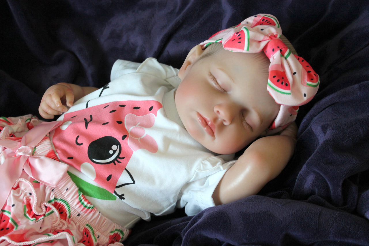 Reborn doll in watermelon outfit that says summer. Lifelike Reborn Baby Doll 20” 2 to 8 Pounds Weighted Newborn Baby Girl/Boy Soft Heavy Baby Dolls For Children Child Friendly Gifts For Girls