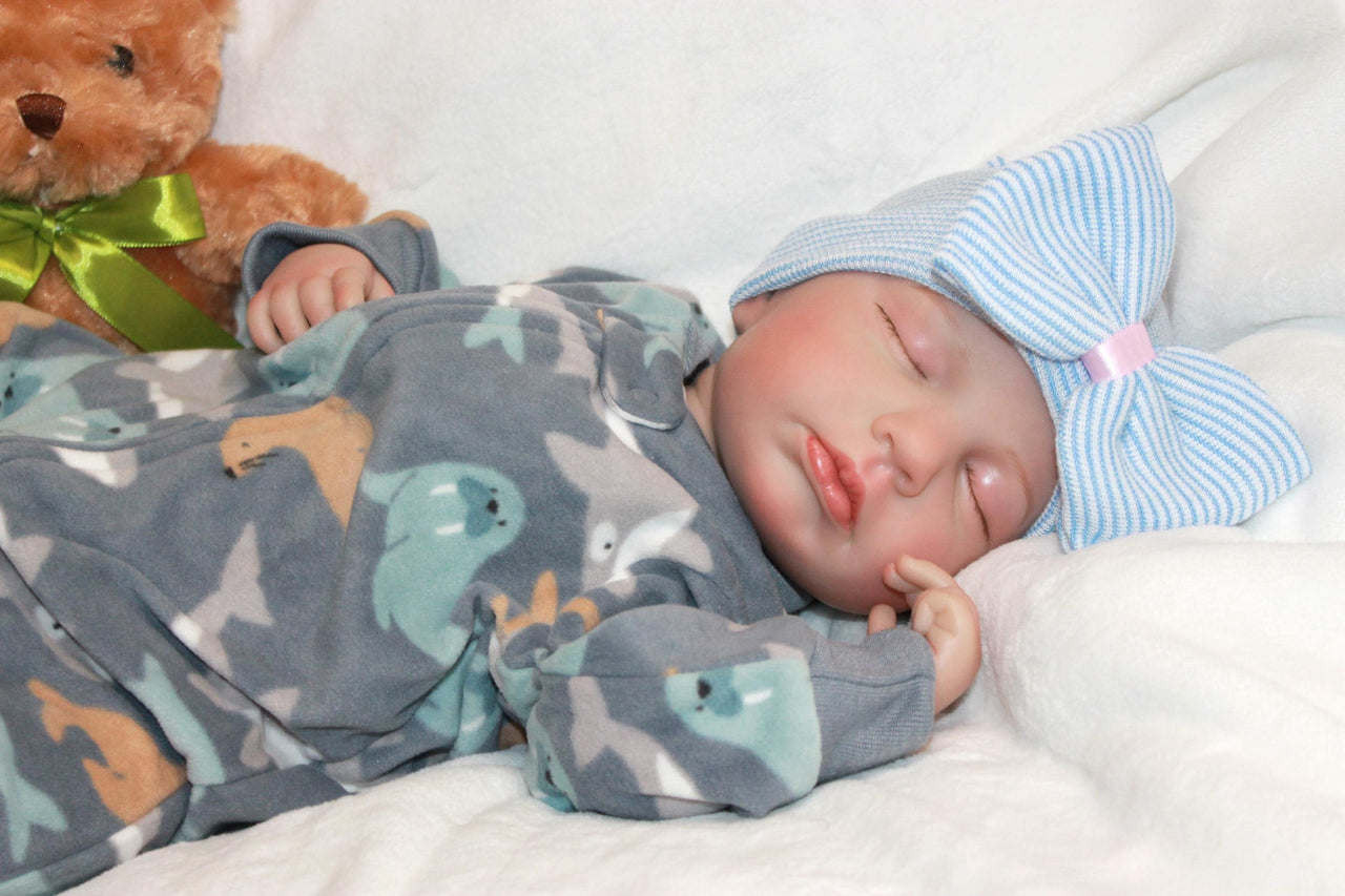 A cute baby in a bow, cuddling a teddy bear, embodying warmth and playfulness.