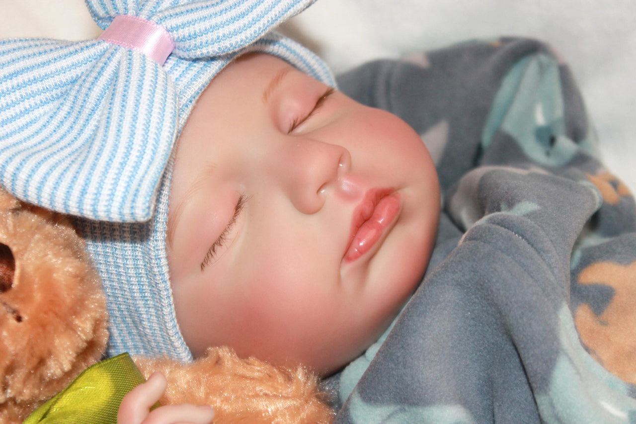 An adorable baby with a bow, embracing a teddy bear, showcasing a moment of pure childhood delight.