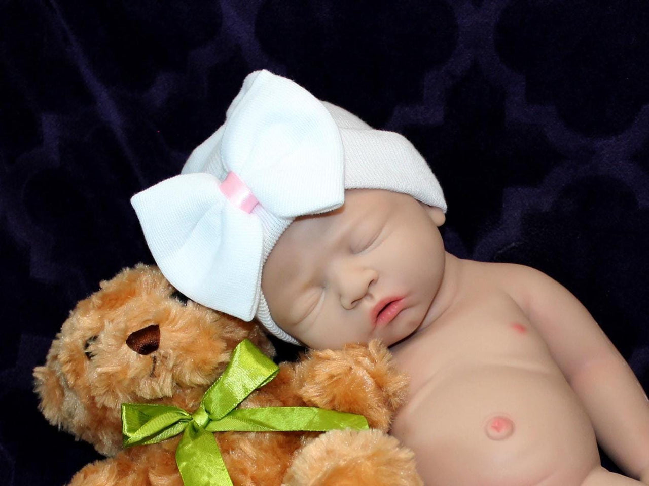 A baby doll, a cuddly teddy bear, and a cheerful toy are arranged together, symbolizing childhood playfulness.