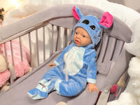 Thumbnail for A baby doll wearing a blue outfit, featuring a cute expression and soft, plush material.