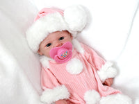 Thumbnail for A baby doll with a pacifier rests on a soft blanket, showcasing its cute features and gentle expression.