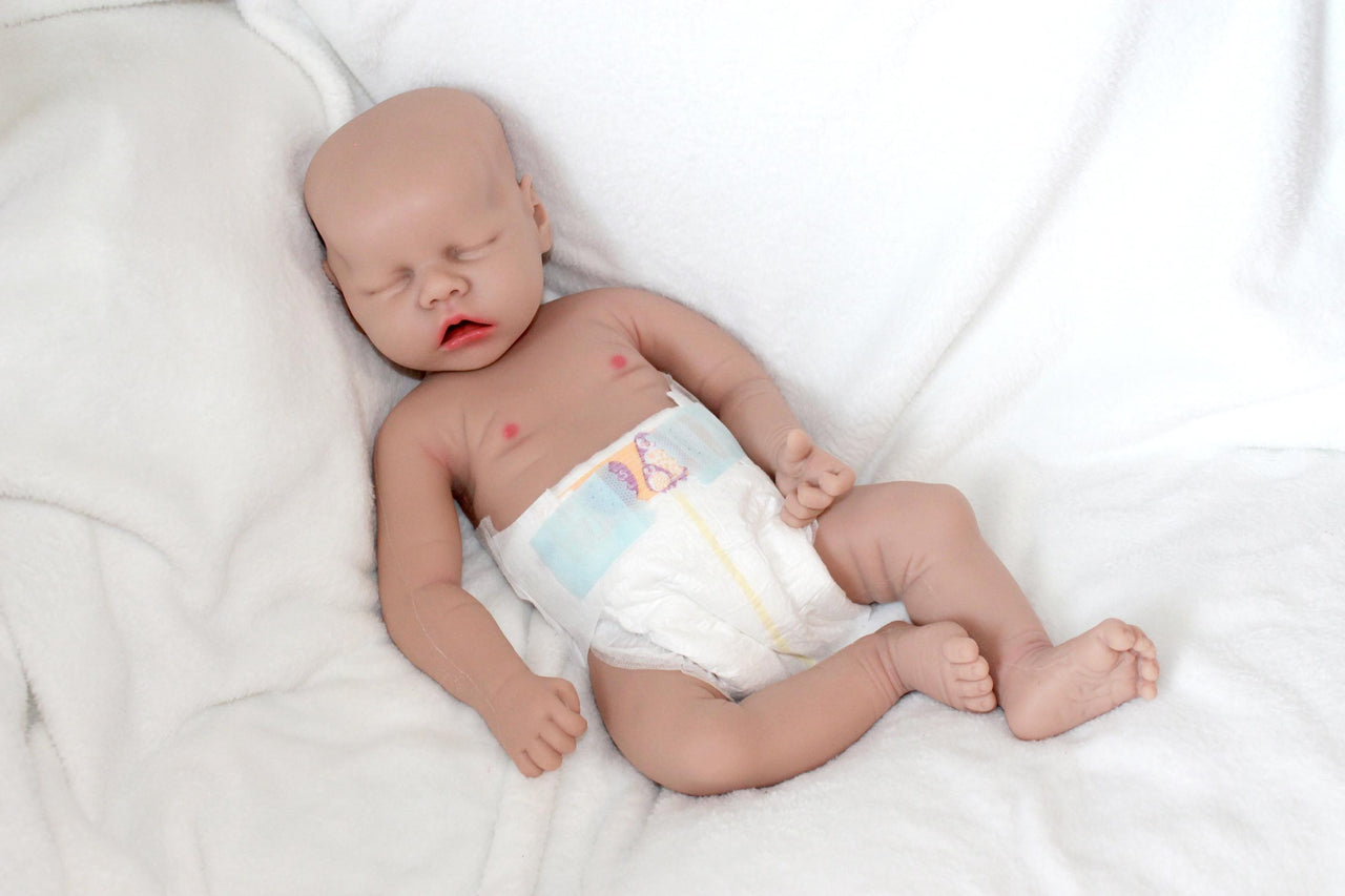 A baby doll wearing a diaper on its face, creating a whimsical and amusing visual.