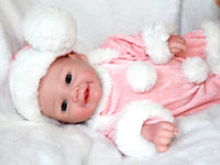 Thumbnail for A baby doll wearing a pink and white outfit, featuring a sweet expression and soft, cuddly features.