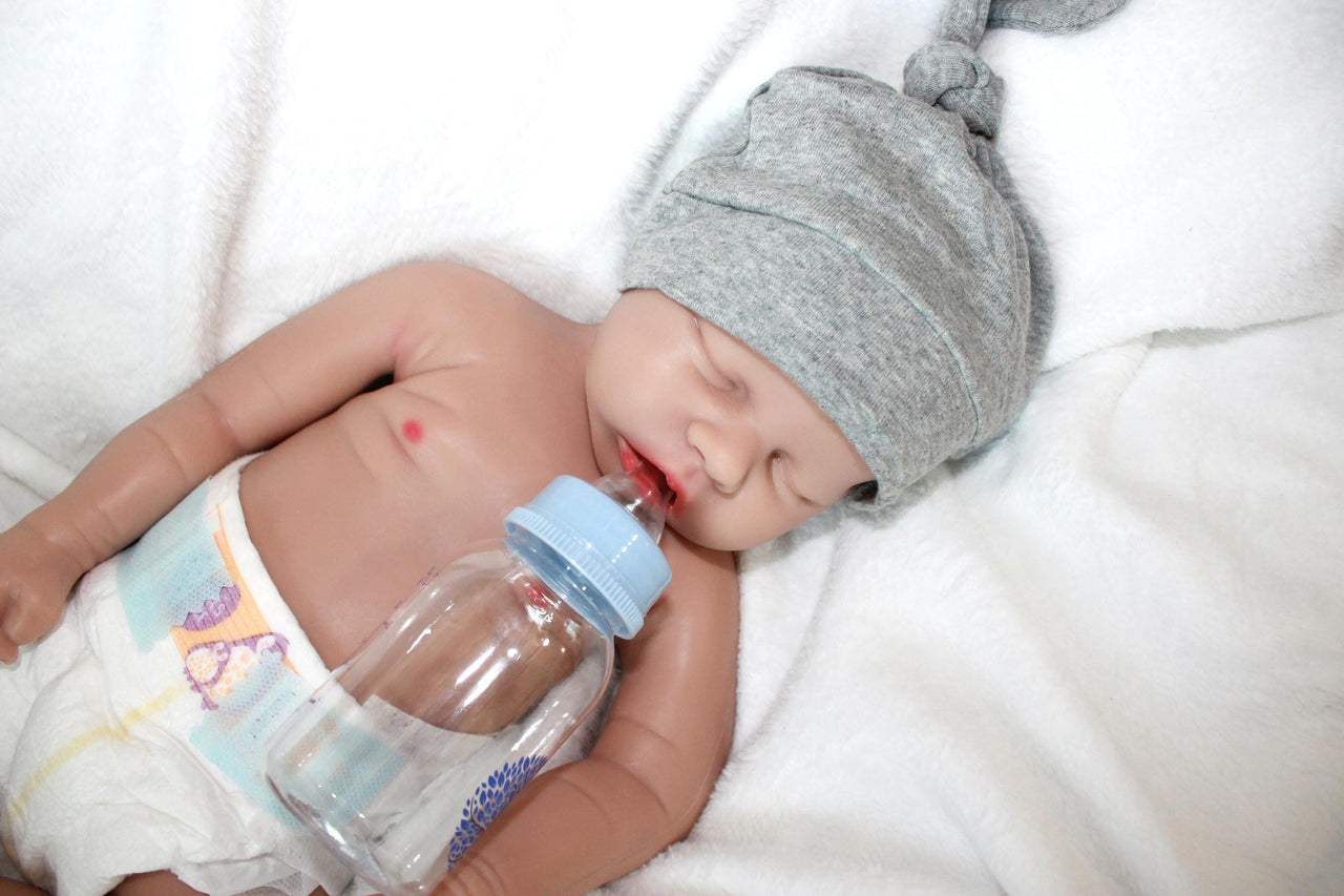 A baby doll wearing a diaper on its face, creating a whimsical and amusing visual.