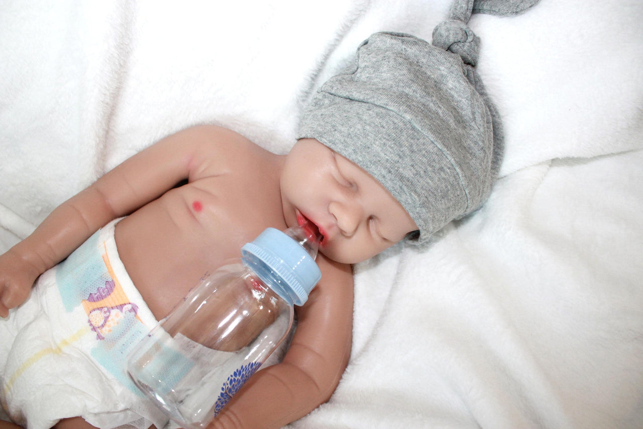 A baby doll wearing a diaper on its face, creating a whimsical and amusing visual.