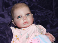Thumbnail for Realistic reborn baby doll dressed in pink floral pajamas with pacifier, cuddly lifelike doll for kids to play and nurture