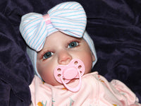 Thumbnail for Weighted reborn baby doll with blue eyes and soft cloth body, therapy doll designed for comfort, realism, and relaxation