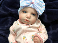 Thumbnail for Weighted reborn baby doll with blue eyes and soft cloth body, therapy doll designed for comfort, realism, and relaxation