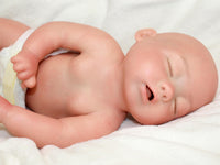 Thumbnail for Full silicone reborn baby doll 13 inches with closed eyes, bald head, and diaper, realistic preemie newborn doll on white blanket