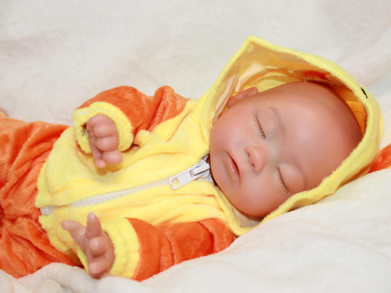 Handmade reborn silicone baby doll, 13-inch lifelike preemie dressed in yellow duck-themed pajamas, realistic collectible newborn doll