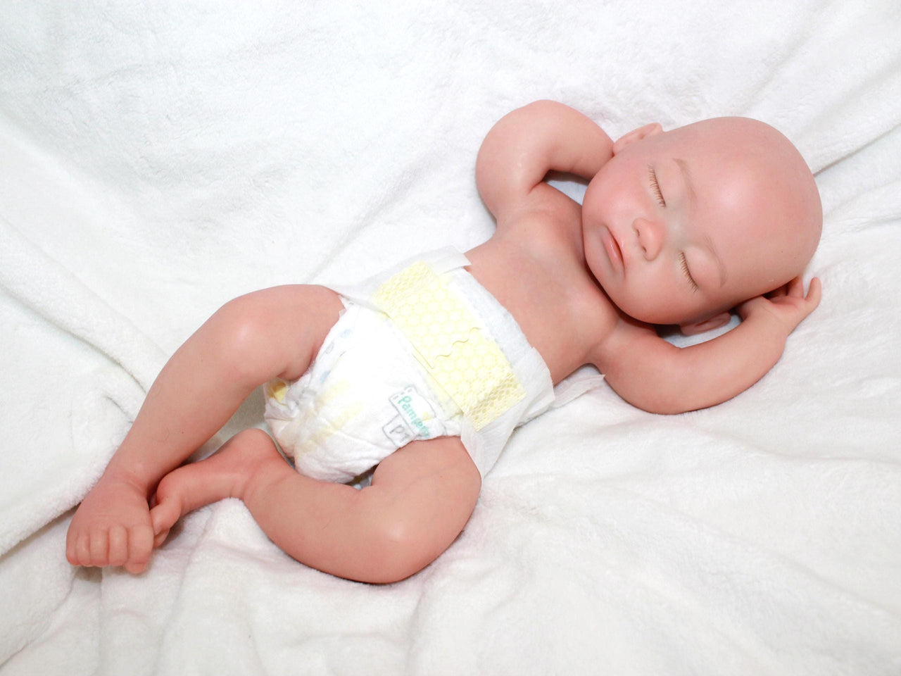 Realistic full silicone reborn baby doll, 13-inch preemie with closed eyes, soft flexible body, collectible newborn therapy doll