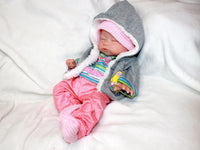 Thumbnail for Realistic full silicone reborn baby doll dressed in colorful striped top with pink pants and hat, handmade preemie newborn doll