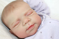 Thumbnail for A baby lies peacefully on a soft white blanket, surrounded by a serene atmosphere.