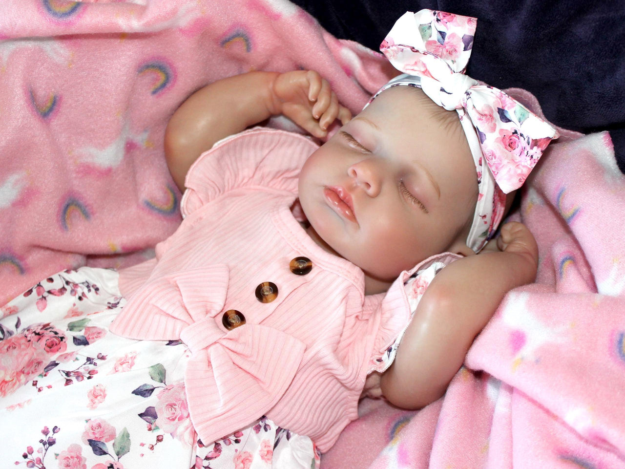 Doll with rotating arms and a rotating head with a cloth body and vinyl limbs. The hair is painted on the head.