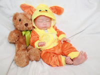 Thumbnail for Sleeping reborn baby doll in yellow and orange duck costume with floppy ears, lifelike 13-inch silicone newborn doll on white blanket