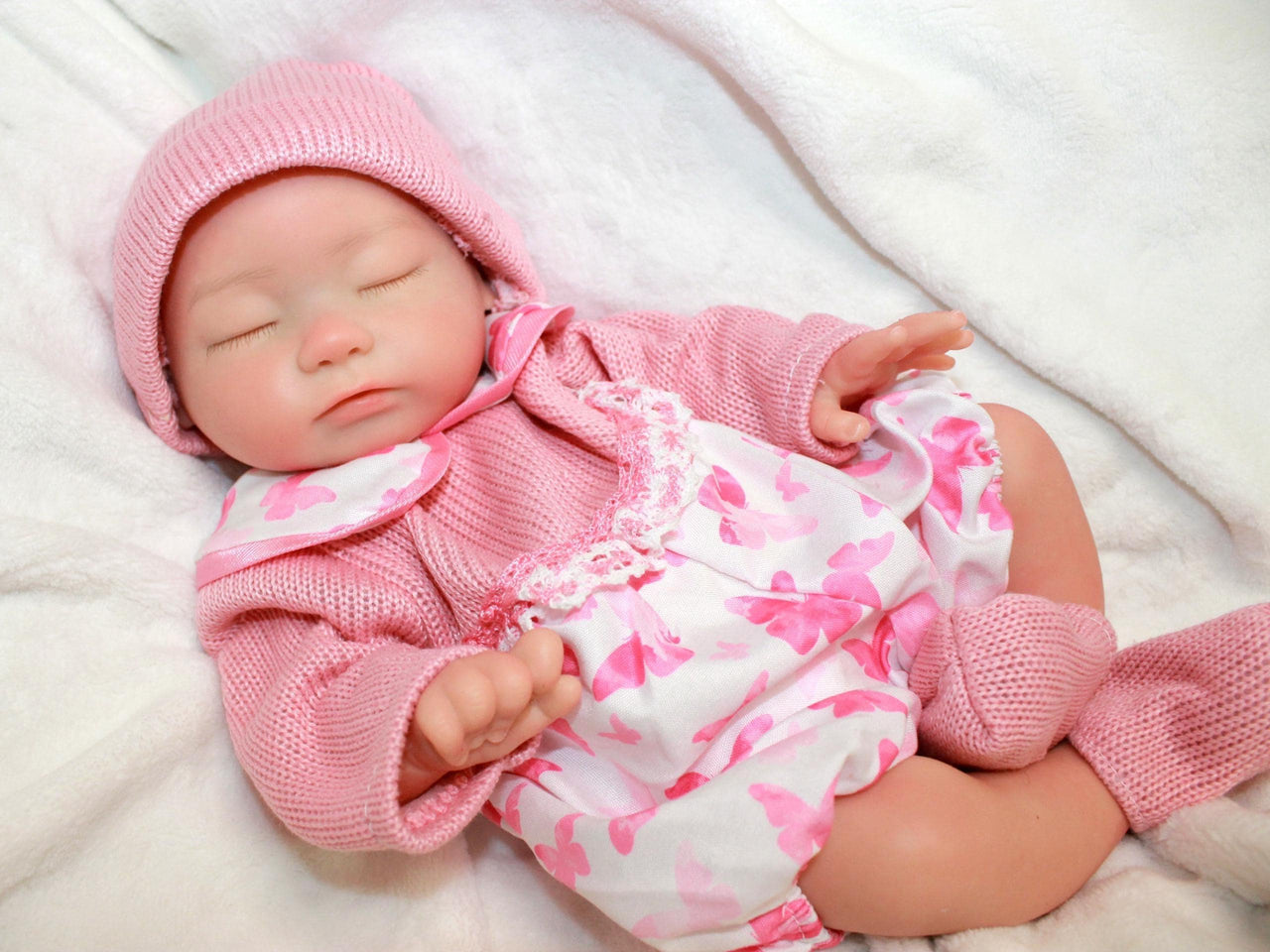Realistic full silicone reborn baby doll, 13-inch preemie with closed eyes in pink outfit, handmade newborn therapy and collector doll