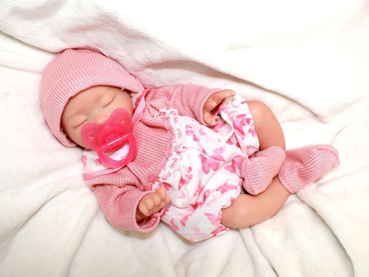 Realistic full silicone reborn baby doll, 13-inch preemie with closed eyes in pink outfit, handmade newborn therapy and collector doll