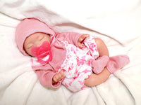 Thumbnail for Realistic full silicone reborn baby doll, 13-inch preemie with closed eyes in pink outfit, handmade newborn therapy and collector doll